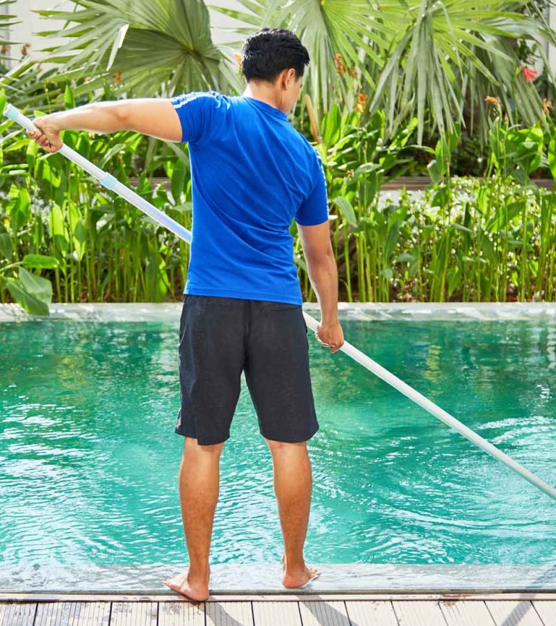 young-man-cleaning-pool-e1628821970333.jpg